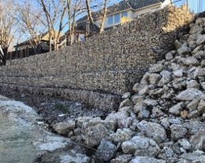 Gabion wall near homes