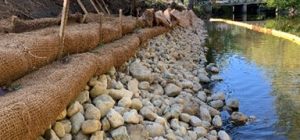 Biodegradable block soil lifts on stone toe 